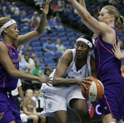 
Minnesota's Tiffany Stansbury gets trapped against Phoenix's defense.Associated Press
 (Associated Press / The Spokesman-Review)