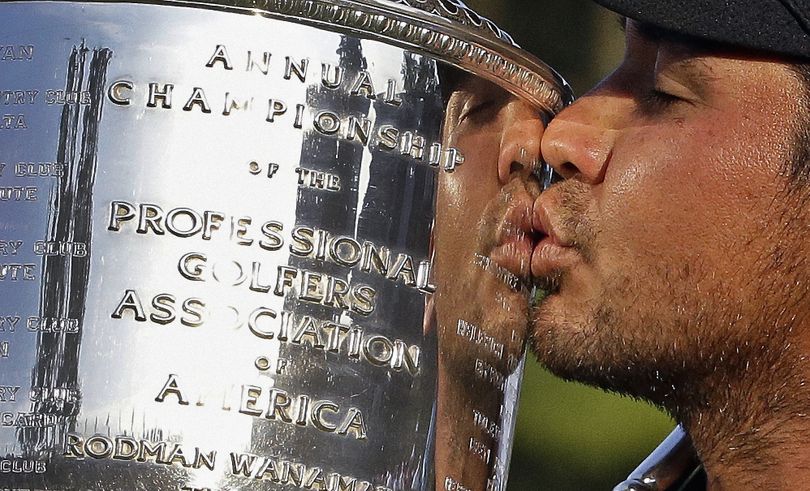 Jason Day, who finished at 20 under, kisses Wanamaker Trophy after winning PGA Championship for long-awaited victory in major. (Associated Press)
