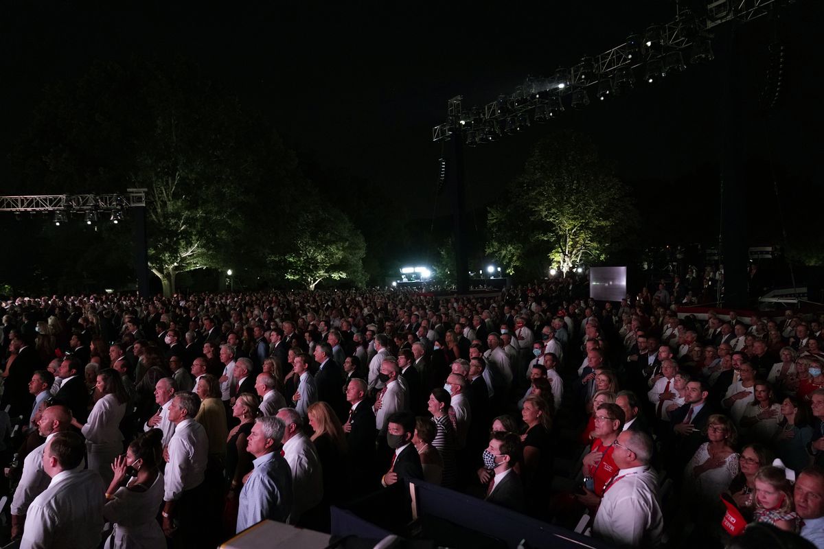 A crowd says the Pledge of Allegiance on the South Lawn of the White House on the fourth day of the Republican National Convention, Thursday, Aug. 27, 2020, in Washington.  (Alex Brandon)