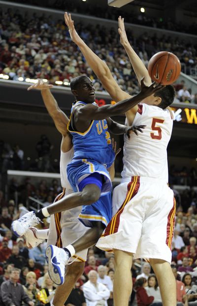 UCLA guard Darren Collison drives past USC forward Nikola Vucevic during the first half. Collison scored 18 points. (Associated Press / The Spokesman-Review)