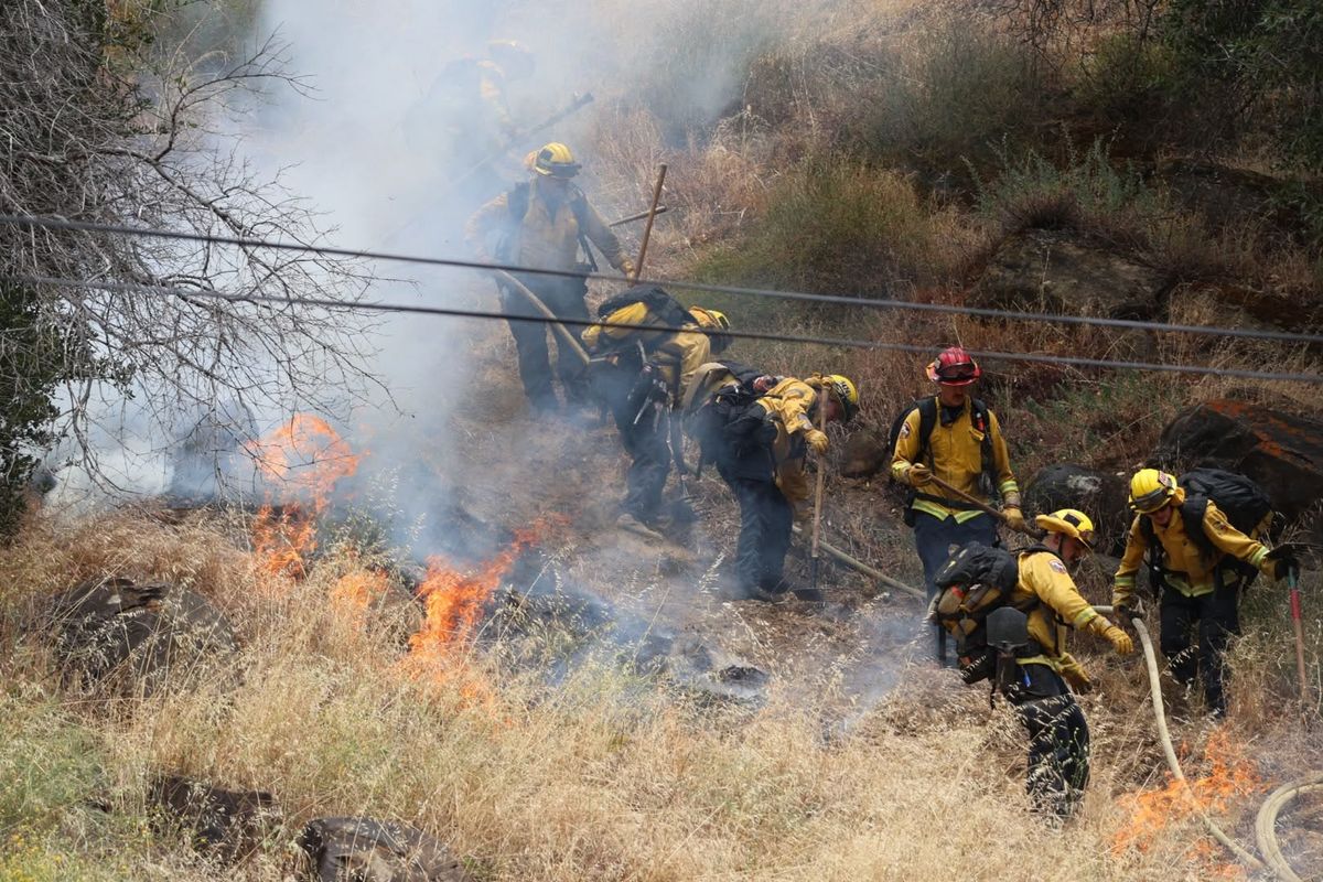 Firefighters work the line of the Putah fire Monday in Yolo County, California. (Provided by Cal Fire)