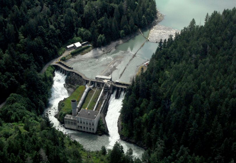 This photo taken July 29, 2011, shows an aerial view of the Elwha Dam west of Port Angeles, Wash. Dignitaries will gather at the site today to mark the beginning of the process to dismantle the dam. (Associated Press)