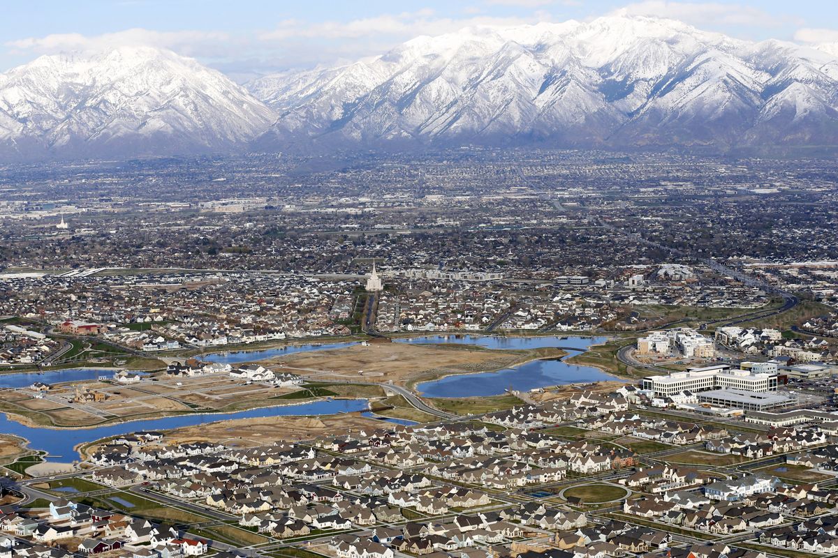 FILE - Homes, in suburban Salt Lake City, are shown on April 13, 2019. Utah is one of two Western states known for rugged landscapes and wide-open spaces that are bucking the trend of sluggish U.S. population growth. The boom there and in Idaho are accompanied by healthy economic expansion, but also concern about strain on infrastructure and soaring housing prices.  (Rick Bowmer)