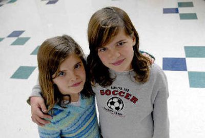 
Hayden Meadows Elementary School fourth-graders Sarah Lambert, left, and Megan Lambert are student tutors. 
 (Kathy Plonka / The Spokesman-Review)