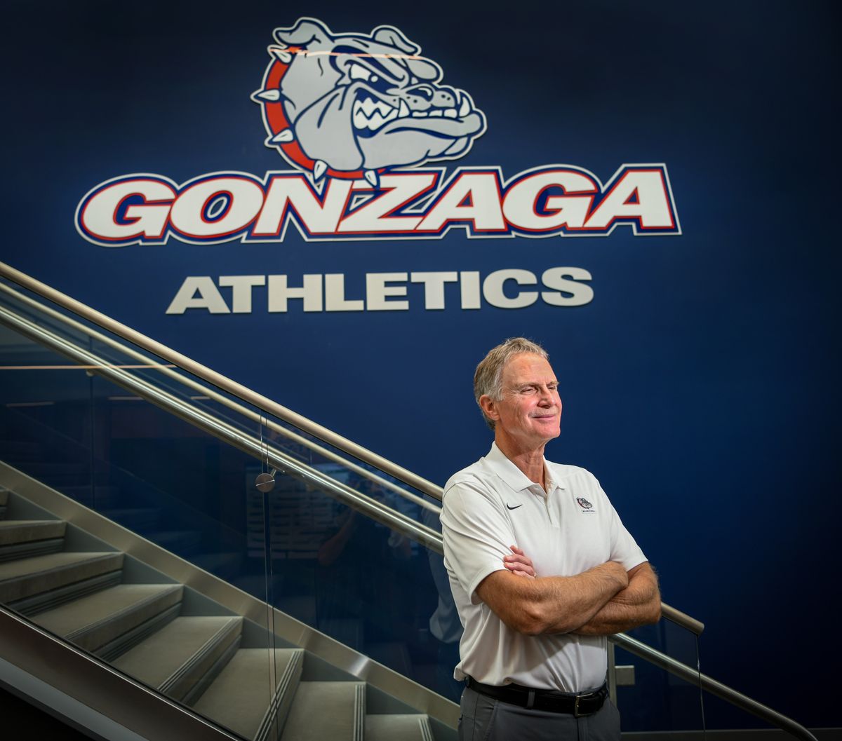 Gonzaga University athletic director Mike Roth takes a pause Monday in the hallway of the Volkar Center. He will wrap up 24 years on the job Tuesday.  (DAN PELLE/THE SPOKESMAN-REVIEW)