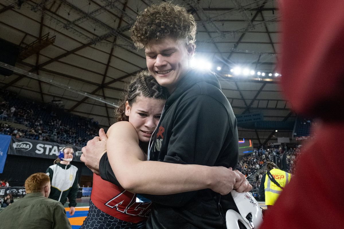 Almira/Coulee-Hartline’s Karis Butler, left, celebrates after winning her first state title with her older brother Noah Butler during Mat Classic 37 on Saturday at the Tacoma Dome in Tacoma. Noah Butler also won a state title later Saturday evening.  (Madison McCord/For The Spokesman-Review)