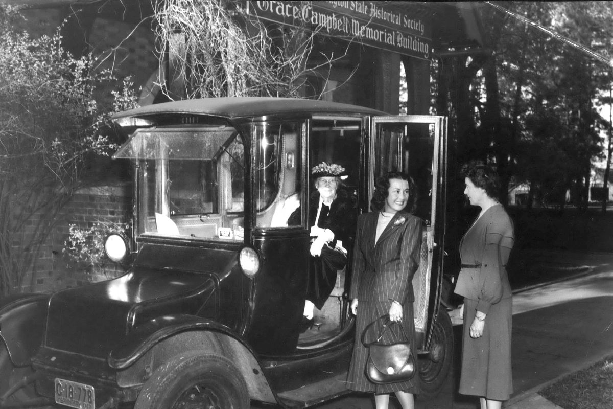 1940 - Agnes McDonald, at around 75 years of age, sits in her 1916 Rauch and Lang electric car in front of the Campbell House. “I wouldn’t own any other kind of car,” says McDonald, whose average operating expense was $2.50 a month. In addition, every five or six years she had to buy new batteries costing $500. The 24-year old car, mileage unknown, because the speedometer gave up the ghost years ago, still has one of its original tires. (photo archive / SR)