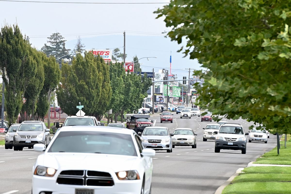 Sprague Avenue is photographed looking east toward University Road on Friday in Spokane Valley. This stretch of Sprague Avenue will be reduced from five lanes to three as part of a pilot study running from Monday through Oct. 28.  (Tyler Tjomsland/The Spokesman-Review)