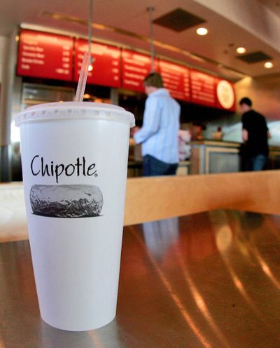 Customers place their orders at a Chipotle restaurant in Gilbert, Ariz. Since going public in January 2006, Chipotle has jumped from $44 a share to $327.85. (Associated Press)