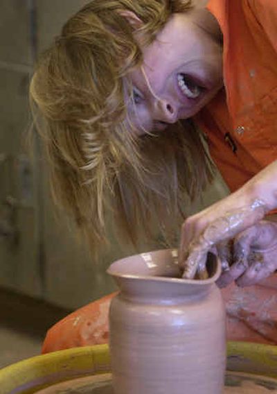 
University High senior Layne Brower, 18, throws a piece during the advanced pottery class at University High in the Spokane Valley. This is Brower's second year in advanced pottery. 
 (Liz Kishimoto / The Spokesman-Review)