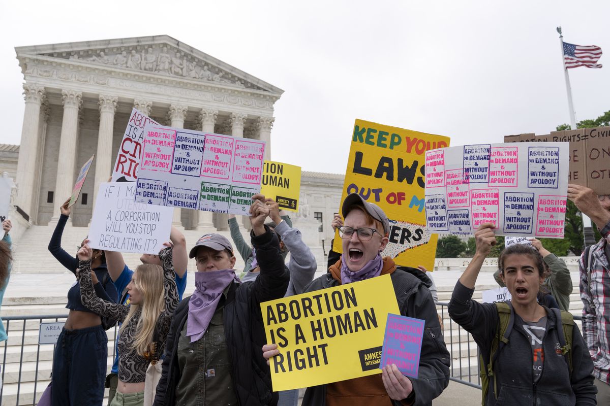 Demonstrators protest outside of the U.S. Supreme Court Tuesday, May 3, 2022 in Washington. A draft opinion suggests the U.S. Supreme Court could be poised to overturn the landmark 1973 Roe v. Wade case that legalized abortion nationwide, according to a Politico report released Monday. Whatever the outcome, the Politico report represents an extremely rare breach of the court