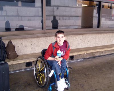 Mead student Benjy Migliuri (with gnome – a family traditon) is seen at Sea-Tac International Airport.