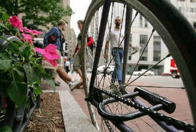 
A Kryptonite bicycle lock rests on a frame on a Boston sidewalk. A low-tech flaw in the design of some Kryptonite locks, as well as similar models from other companies, shows that the locks can be picked quickly and easily using a ballpoint pen. 
 (Associated Press / The Spokesman-Review)
