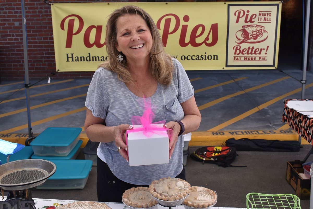 Patti Adams of Patti’s Pies sells her baked goods at Wonder Saturday Market on May 29. Adams has retired after 34 years of teaching at Deer Park Middle School to devote herself full time to Patti’s Pies.  (Don Chareunsy/The Spokesman-Review)