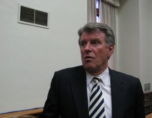 Gov. Butch Otter talks with reporters after a proclamation-signing on Tuesday morning. The governor said the 2-cent gas tax increase bill that the House is poised to amend currently doesn't go far enough to address the need for additional road work. (Betsy Russell / The Spokesman-Review)