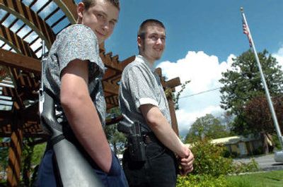 
Stephen Doty, 15, left, and his brother, Zach Doty, 18, carry guns in public to exercise their Second Amendment rights. 
 (Jesse Tinsley / The Spokesman-Review)