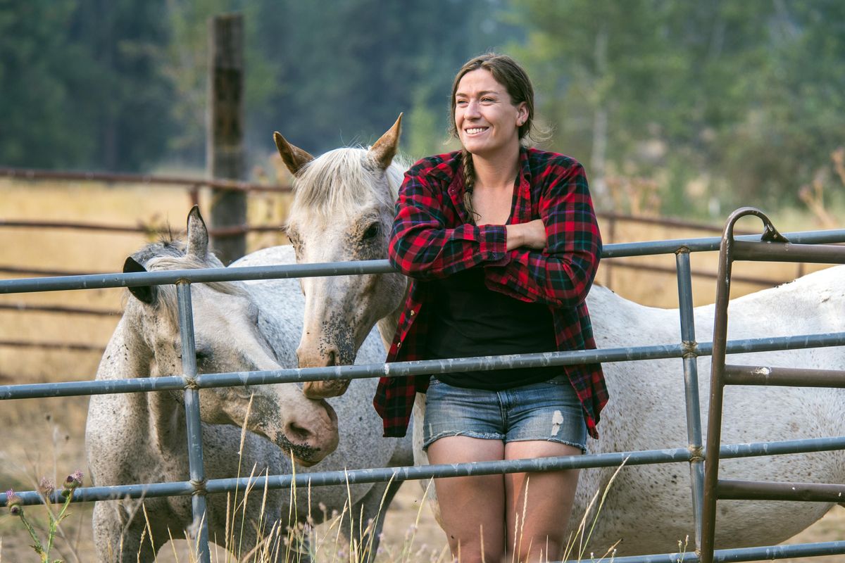 Two farm-raised women are putting on a workshop on sustainable farming and ranching at Beth Robinette’s Cheney farm. Beth, shown with her horses, Marshall, left, and Sunka, is a second-generation rancher. (Dan Pelle / The Spokesman-Review)