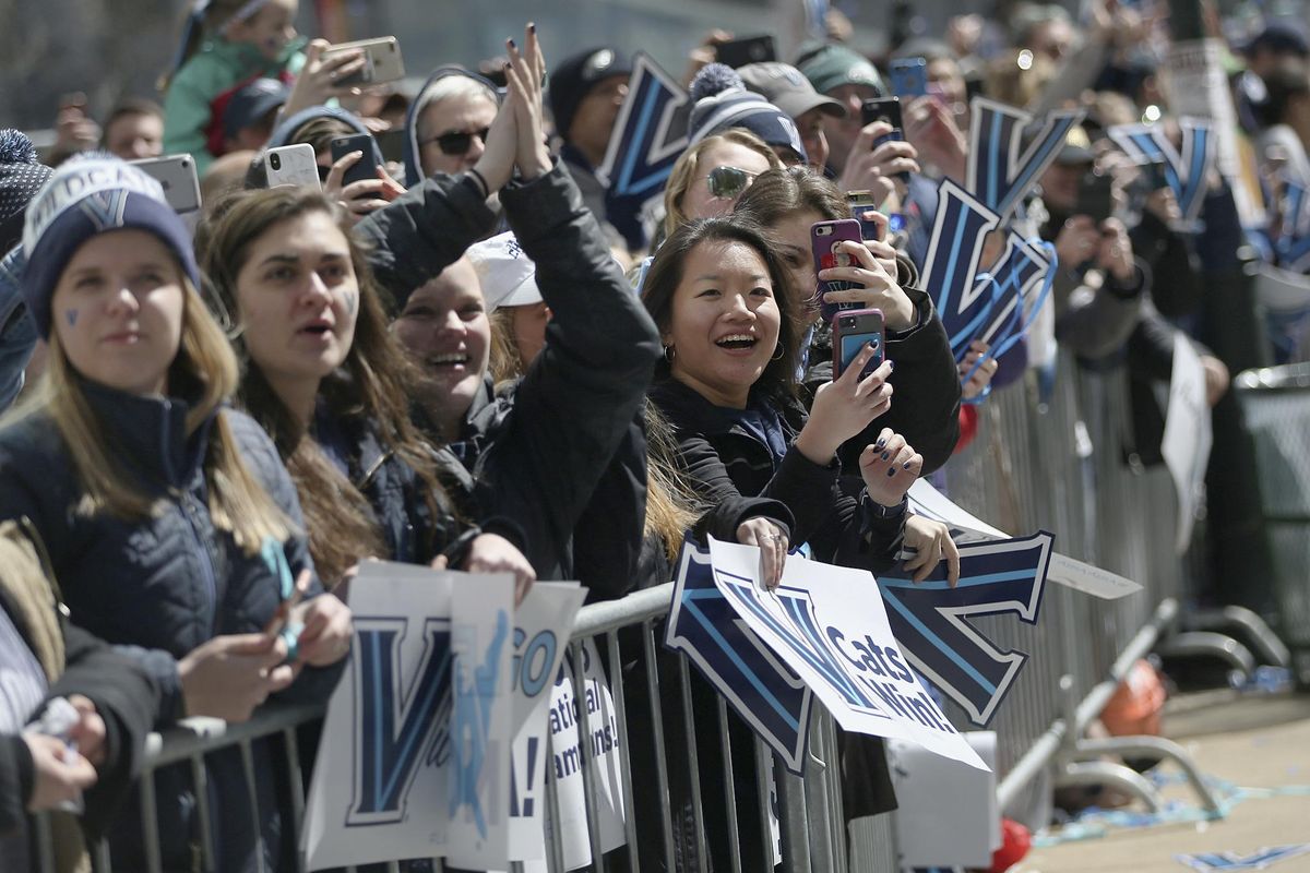 Fans cheer as the players’ buses pass by during Villanova’s NCAA men’s basketball tournament victory parade, Thursday, April 5, 2018, in Philadelphia. (TIM TAI / Philadelphia Inquirer via AP)