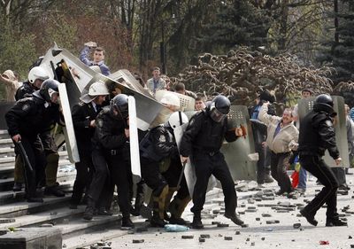 Anti-communist demonstrators throw bricks at riot police Tuesday  in Chisinau, Moldova.  (Associated Press / The Spokesman-Review)