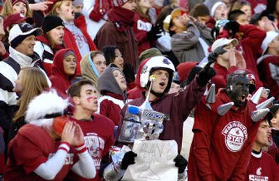 
Washington State fans root full-throat for their Cougars, who finished the regular season with their third consecutive defeat.  
 (Christopher Anderson / The Spokesman-Review)