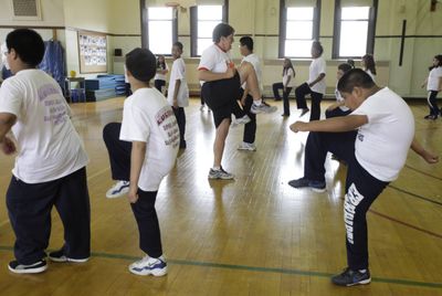 Betty Hale, center, instructs a physical education class in a 100-year-old gymnasium at Eberhart Elementary School in Chicago in May.  (Associated Press / The Spokesman-Review)