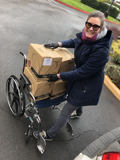 Annie Shull, co-owner and chief operations officer for Raptor Ridge Winery in Newberg, Oregon, delivers a donation of wines produced by her husband, Scott, to a Willamette Valley hospital as part of #winesforthefrontlines. (Photo courtesy of Willamette Valley Wineries Association)