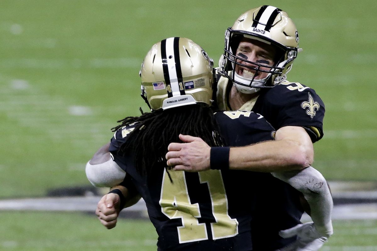 New Orleans Saints quarterback Drew Brees, right, celebrates with running back Alvin Kamara (41) during the second half of an NFL divisional round playoff football game against the Tampa Bay Buccaneers, Sunday, Jan. 17, 2021, in New Orleans.  (Butch Dill)