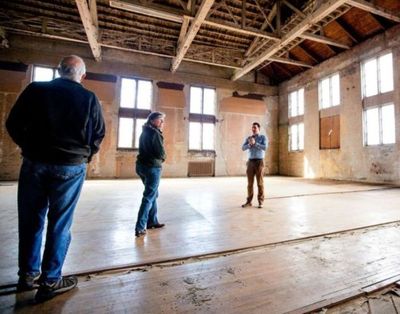 Nick Smoot, right, show friends the interior of the Elks Building on Lakeside Avenue on Thursday. (Jake Parrish/Press photo)