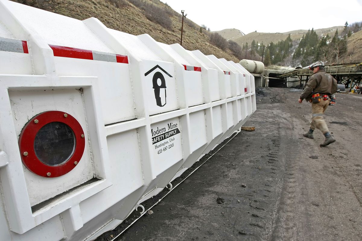 Mine manager Joe Fielder walks past a hardened rescue capsule at the Horizon Coal Mine outside Helper, Utah. The government instituted stricter requirements such as the rescue capsule, along with fines and penalties for noncompliance, after several fatal mine accidents in 2005 and 2006.  (File Associated Press)