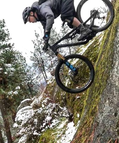 Mountain biker Dan Wilson of Evergreen East plummets down an advanced roller feature at Beacon Hill/Camp Sekani area. The rock is a purely optional route just above the trail Old School. (Chris Madunich / Courtesy)
