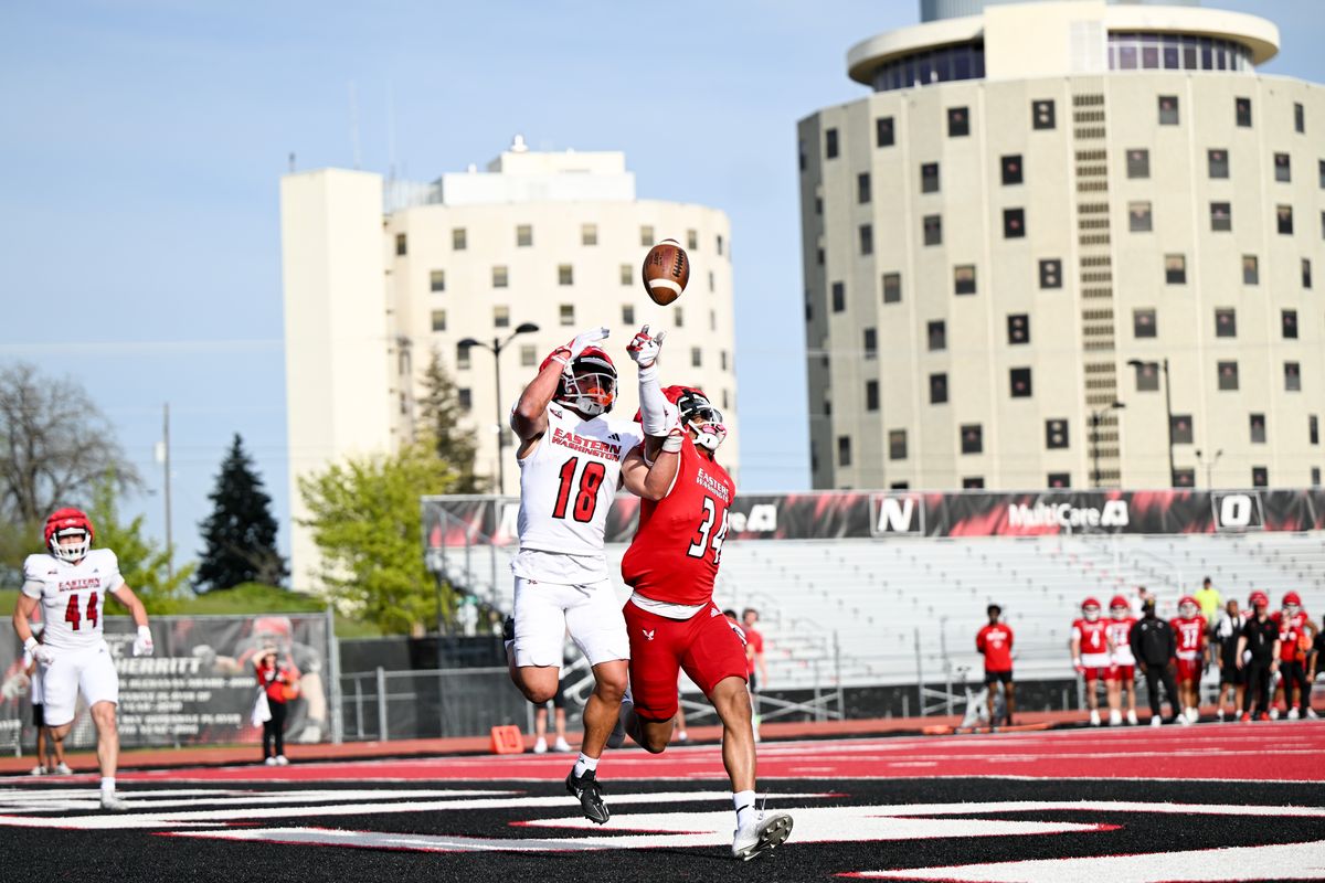 Eastern Washington Eagles cornerback Jojo Maxey-Johnson, right, breaks up a pass intended for wide receiver Cole Pruett during EWU’s Red-White game on Friday at Roos Field in Cheney.  (Tyler Tjomsland/The Spokesman-Review)