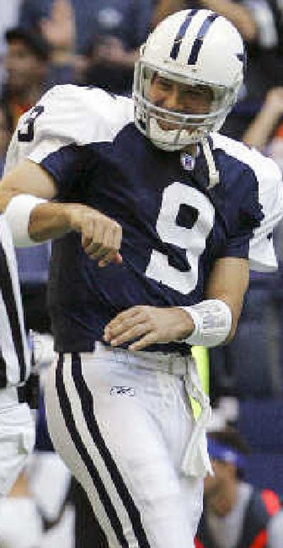 
Dallas quarterback Tony Romo after throwing a touchdown pass. 
 (Associated Press / The Spokesman-Review)