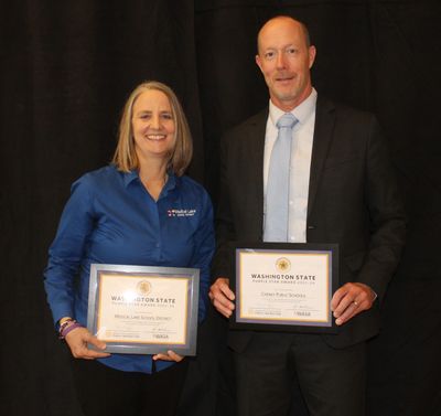 Medical Lake School District Superintendent Kim Hendrick and Cheney Public Schools Superintendent Ben Ferney hold their Purple Star awards after a recent awards banquet.  (Courtesy of NorthEast Washington Educational Service District (NEWESD) 101)