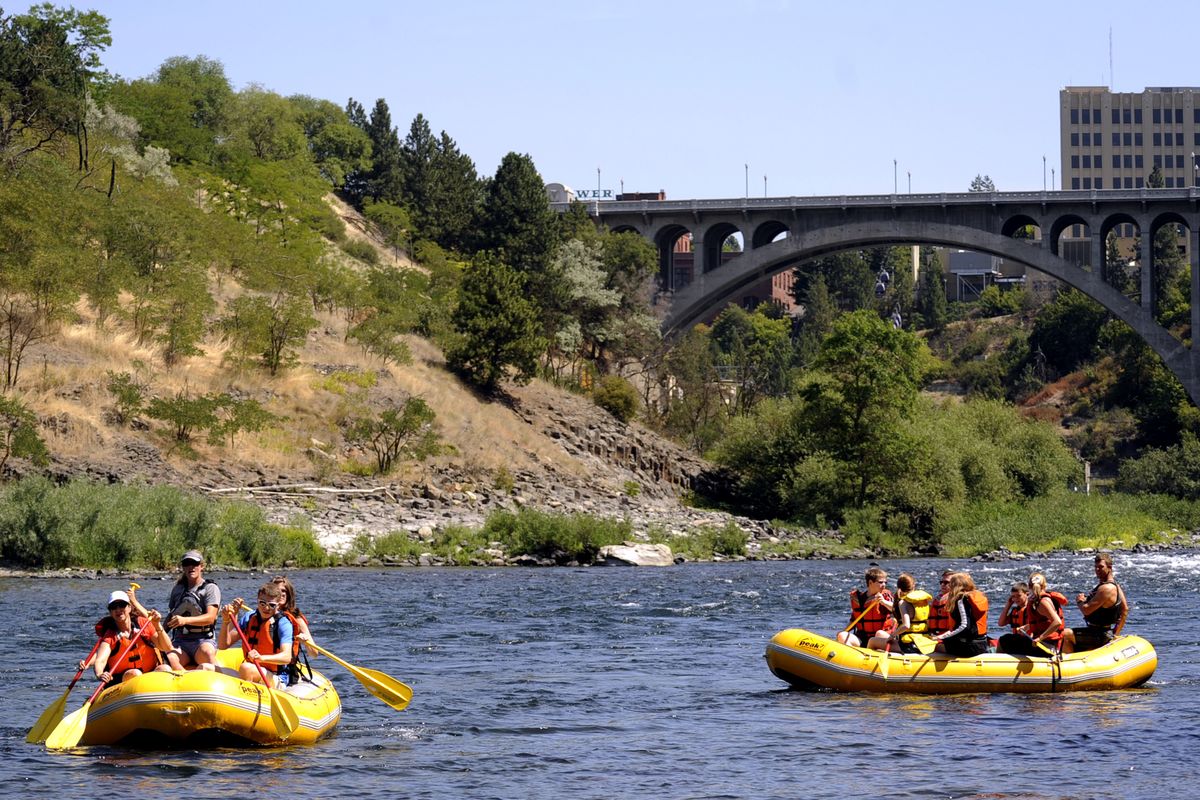 In the shadow of the Monroe Street Bridge, rafters take off from the Peaceful Valley area in this file photo. (File)