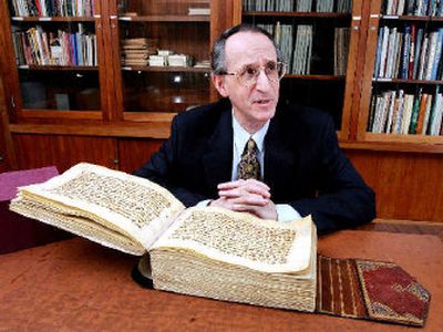 Don C. Skemer, curator of manuscripts for Princeton University, poses with a holy Quran from the ninth century in his office in the Firestone Library at Princeton. The university has the largest collection of Islamic manuscripts in Norh America.
(Associated Press / The Spokesman-Review)