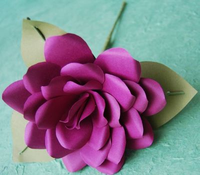 To make the petals for this rose designed by Anemone Paper Flowers, cut several teardrop shapes of varying lengths from paper, then wrap them around a wire stem using floral tape. Special to  (MEGAN COOLEY Special to / The Spokesman-Review)