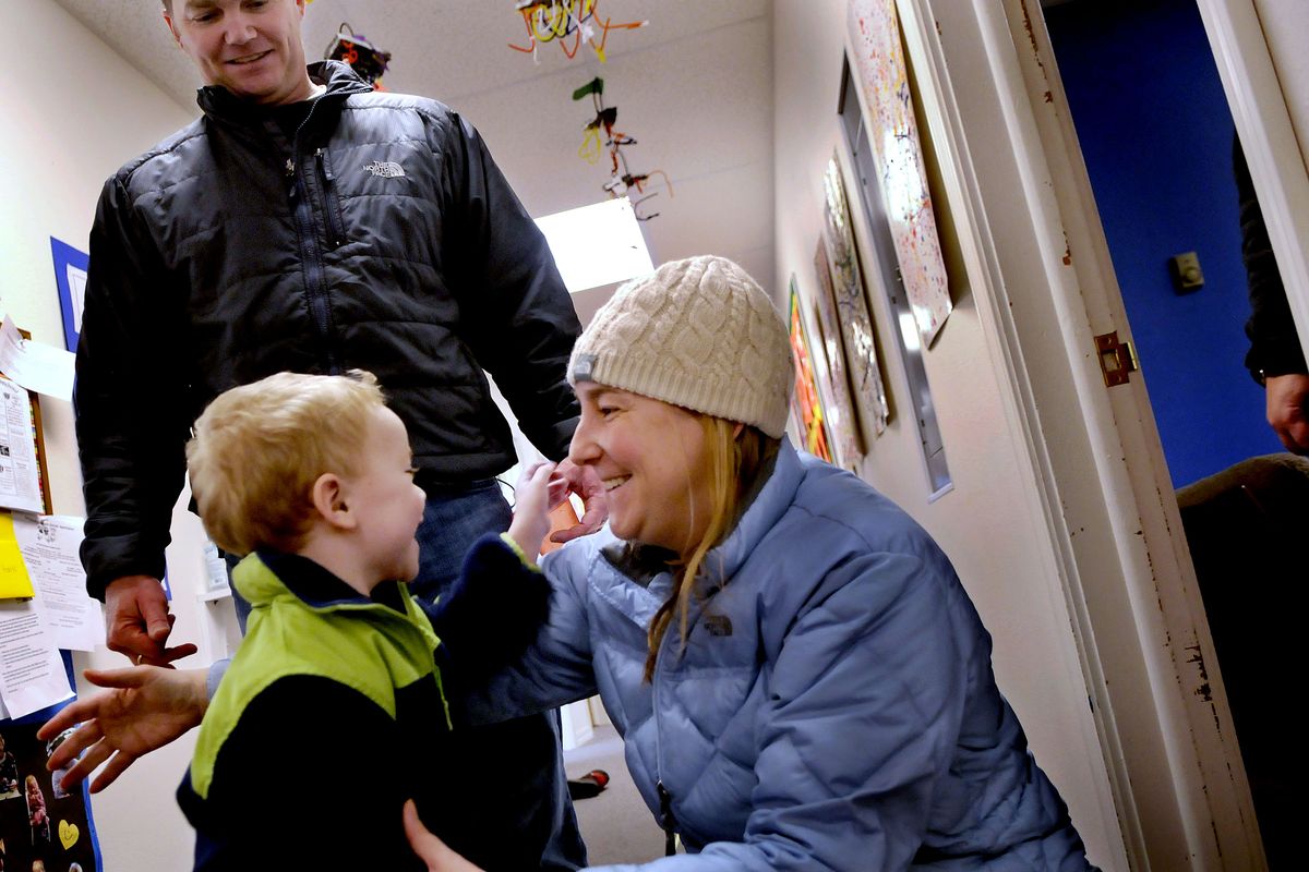 Preschooler Henry Sturgis is greeted by his parents, Brian and Tricia Sturgis, at Little Sprouts Preschool in Sandpoint.