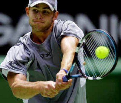 
American Andy Roddick, the No. 2 seed, hits a backhand return during his third-round win over Austria's Jurgen Melzer. 
 (Associated Press / The Spokesman-Review)