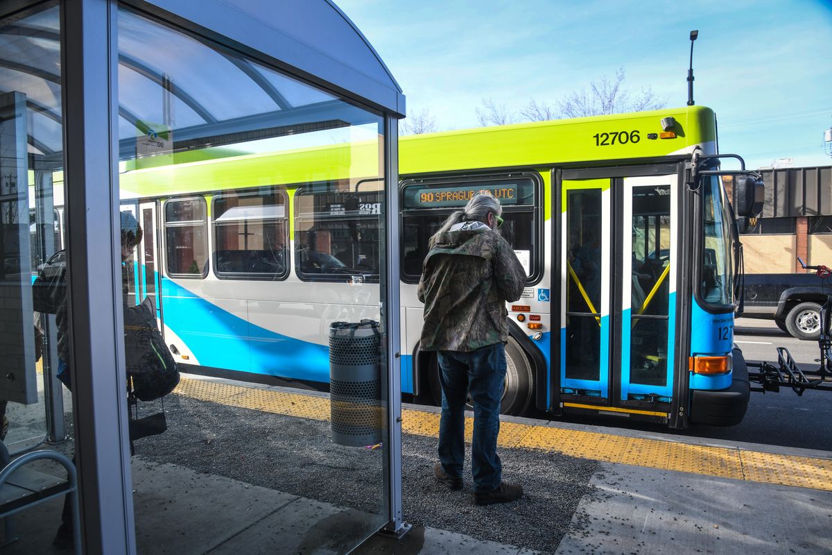 Riders catch a STA bus at the corner of Sprague Avenue and Helena Street on  April 2, 2019. (Dan Pelle / The Spokesman-Review)