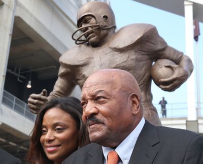 Former Cleveland Browns' great, Jim Brown, with his wife Monique was honored by the team during an unveiling of his statue, September 18, 2016, at FirstEnergy Stadium.  (Tribune News Service)