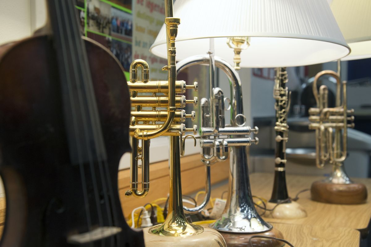 Allan Smith’s crafted lamps from old musical instruments are shown at Chase Middle School, where Smith’s favorite collector, band teacher Gail Phillips, teaches and keeps many of his works. (Jesse Tinsley)