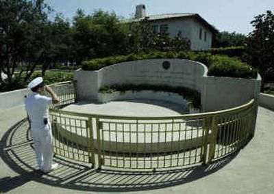 
Randall Dunphy, of the Navy, salutes the burial site of former president Ronald Reagan in Simi Valley, Calif. 
 (AP / The Spokesman-Review)