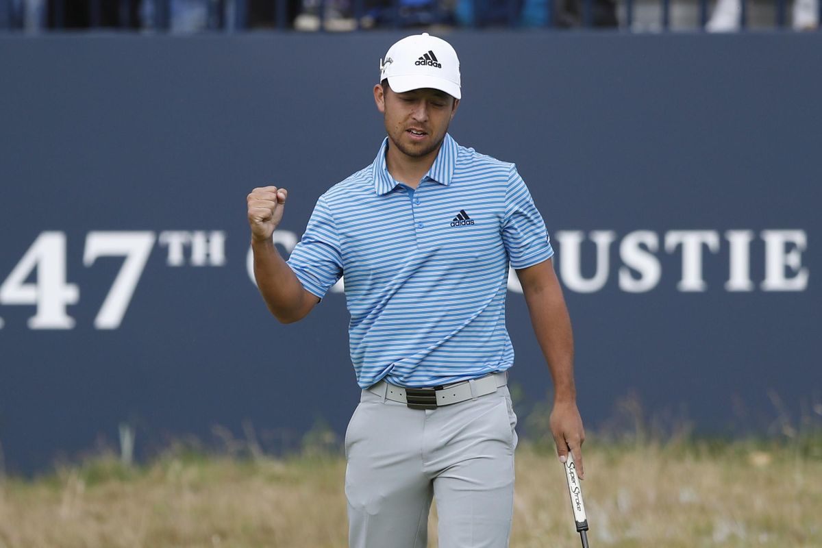 Xander Schauffele  reacts after a birdie on the 18th hole during the third round of the British Open  in Carnoustie, Scotland, on Saturday. (Alastair Grant / AP)