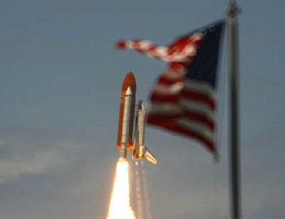 
The Space Shuttle Discovery and its crew of seven blast into orbit Tuesday from Cape Canaveral, Fla., on the first space shuttle launch in a year. 
 (Associated Press / The Spokesman-Review)