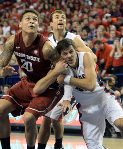 Gonzaga University's Drew Barham (43) hangs on seven-foot Jordan Railey, left, of Washington State and Kevin Pangos takes up position behind them during a rebound Thursday, Nov. 21, 2013 at McCarthey Athletic Center. (Jesse Tinsley / The Spokesman-Review)