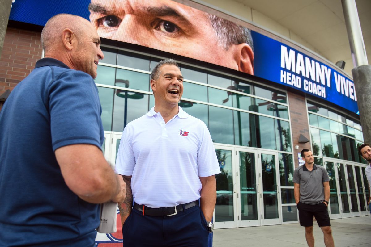 New Spokane Chiefs head coach Manny Viveiros, center, visits with former NHL referee Denny LaRue, left, as former Chiefs greats Derek Ryan and Tyler Johnson, right, await the press conference to announce Viveiros, Wednesday, July 10, 2019, at the Spokane Arena. (Dan Pelle / The Spokesman-Review)