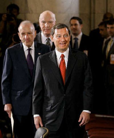 
Supreme Court nominee John Roberts' face lights up Monday as he spots his family waiting for his confirmation hearing. 
 (Associated Press / The Spokesman-Review)