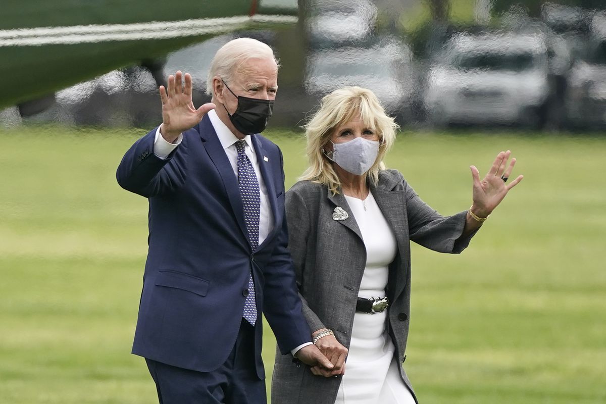 President Joe Biden and first lady Jill Biden wave after stepping off Marine One on the Ellipse near the White House, Monday, May 3, 2021, in Washington. The Biden