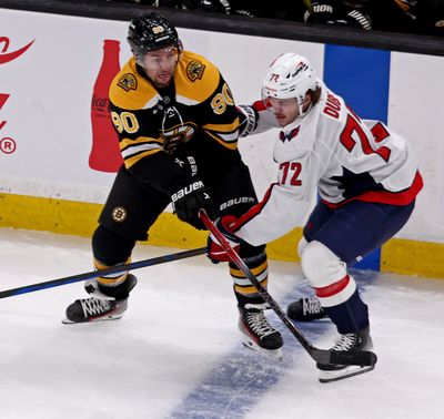 Boston Bruins forward Boston Bruins Tyler Johnson, left, was waived Thursday.  (Tribune News Service)