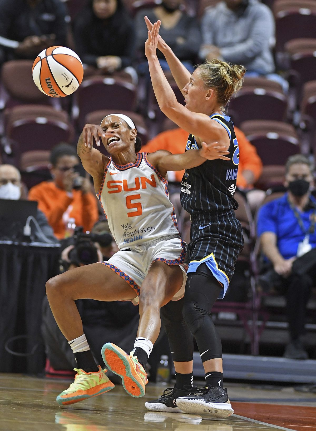 Connecticut Sun guard Jasmine Thomas commits a turnover under pressure from Chicago Sky guard Courtney Vandersloot during a WNBA semifinal playoff basketball game, Tuesday, Sept. 28, 2021, at Mohegan Sun Arena in Uncasville, Conn.  (SEAN D. ELLIOT)